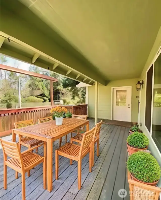 Front covered porch virtually staged shows door to garage