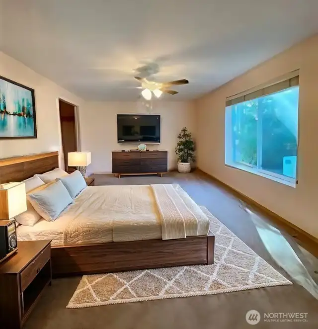primary bedroom staged with King bed