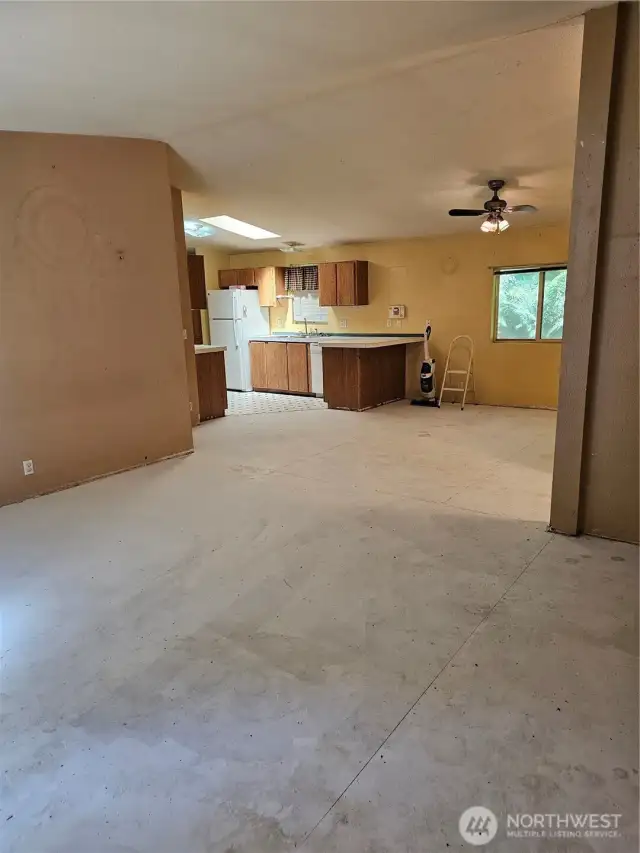 Living room with dining room and kitchen