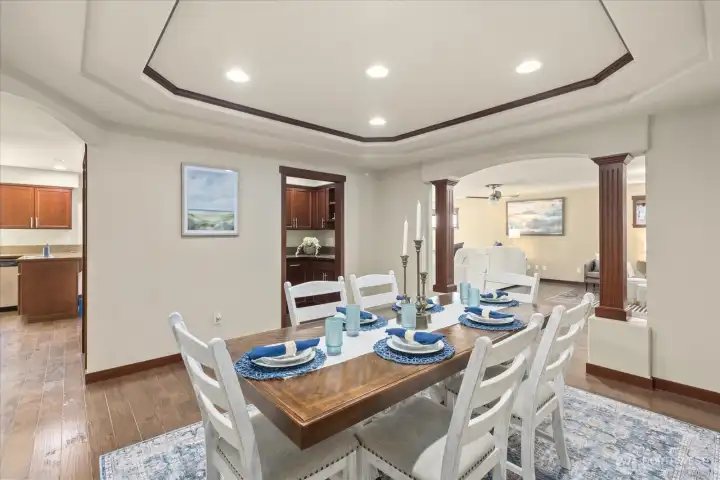 The perfect host’s layout—formal dining room leads to a beautifully equipped butler’s pantry with wet bar and dual fridges.