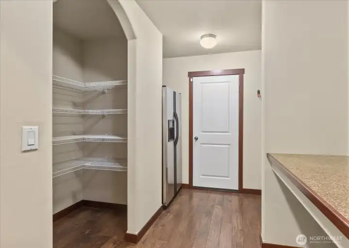 Walk-in Pantry & Additional Fridge. Even space to drop all  as you enter from the garage