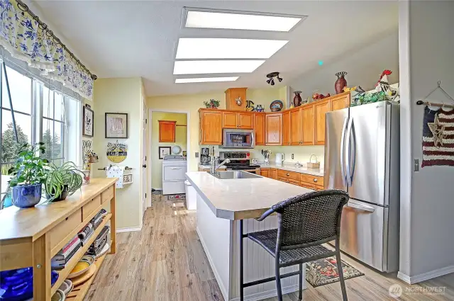 Light & Bright kitchen with eat-at island. Updated stainless steel appliances.