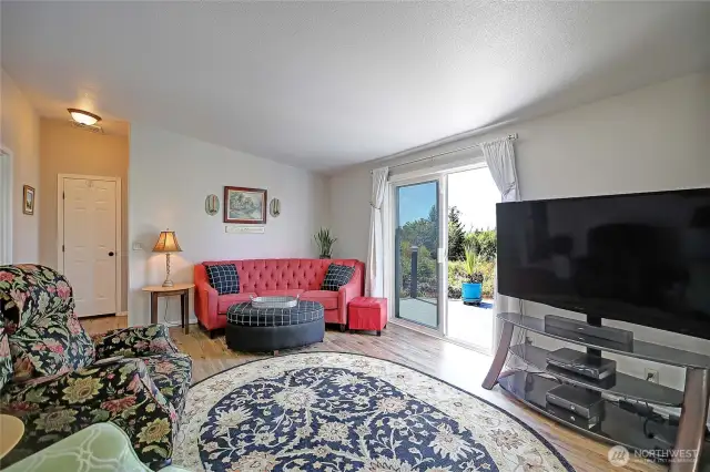 Living room with easy access to the deck & sunset views.