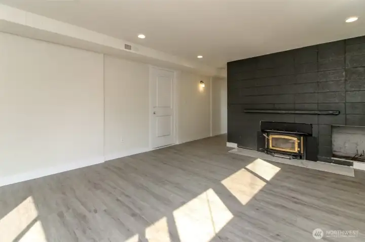 So much more living space in the lower level, complete with a second fireplace!