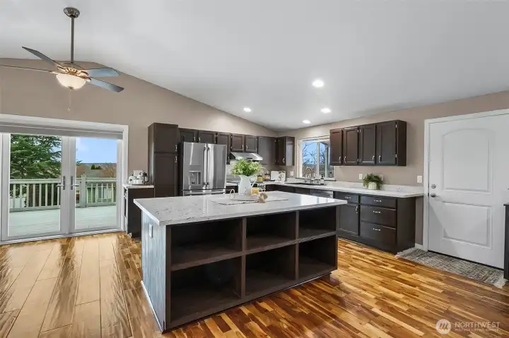 Featuring extensive storage, beautiful quartz countertops, and a spacious open-concept floor plan.