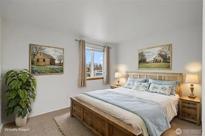 Bedroom #1- Fresh paint, new carpet, and updated white trim and doors.