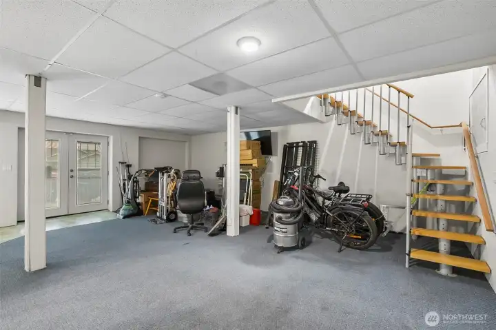 The lower level is ready for your vision — ideal for a MIL suite, game room, or potential for two additional bedrooms.