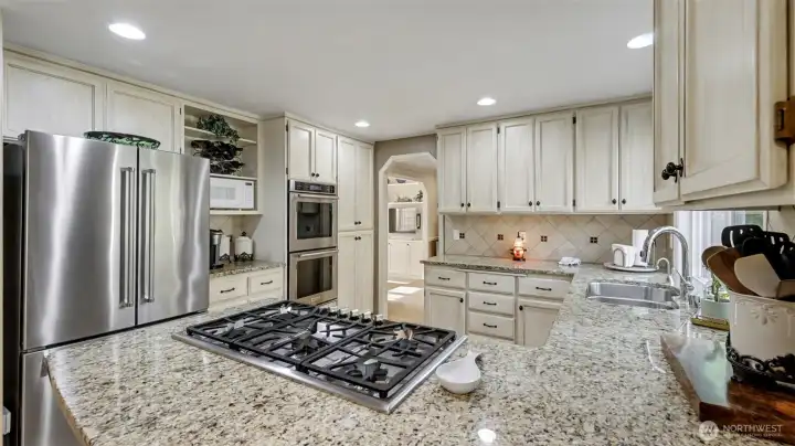 Enjoy this chef-inspired kitchen with modern appliances, generous prep space, and timeless finishes.