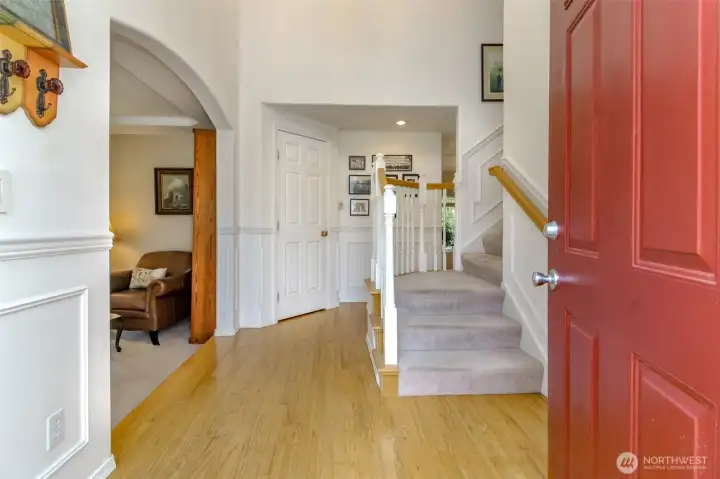 The entry wows the moment you step inside, featuring hardwood floors , soaring ceilings that create an open, airy feel from the moment you enter.
