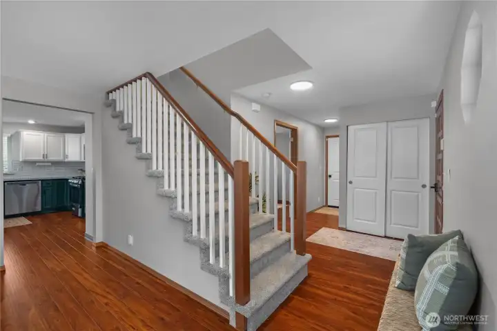Stairway up to 4 bedrooms, 2 bathrooms and a large unfinished storage room above the living space.