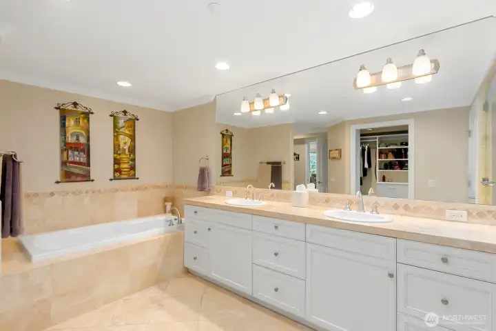 Lux primary bath & walk-in closet w/California Closet built ins.
