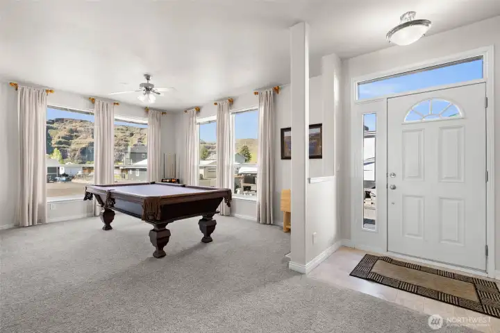 As you enter the larger home.  Pool table room is technically the "living room" with 10" ceilings and windows that face the Basalt Cliffs and the river.