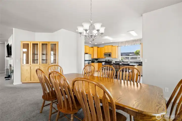 Dining room that fits a table of 10-12.  This home is meant for entertaining and gathering.
