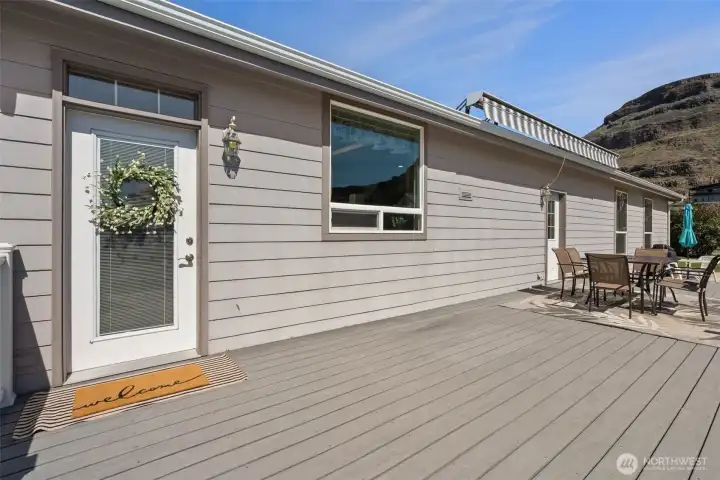 Trex Deck, hardi plank siding and new room in March of 2026.