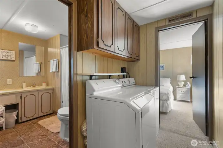 Full size washer and dryer located in hallway between the 2 bedrooms.