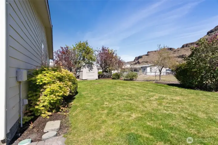 Backyard stretches across both properties.  Partially fenced and often used for tent space for overflow family/freinds