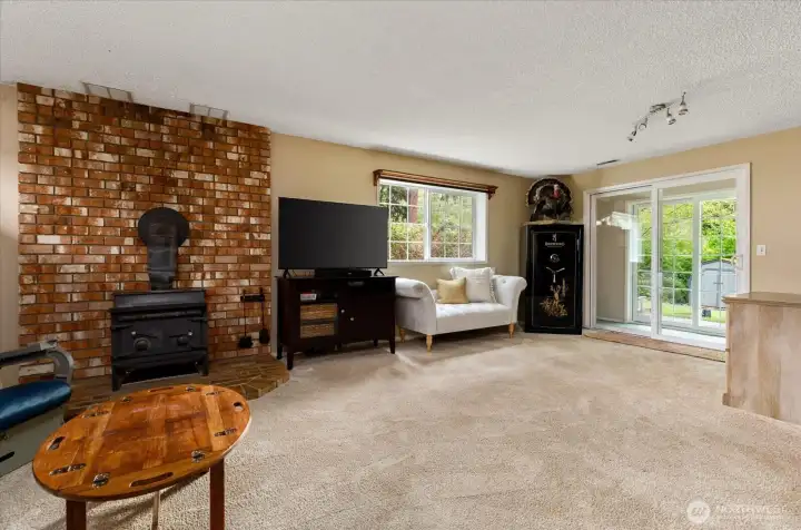 Lower family room with wood burning stove.