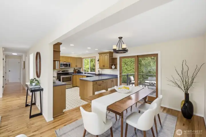Dining rm off kitchen with door to deck
