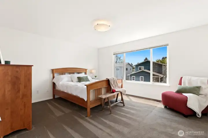 Primary bedroom with double door entry.