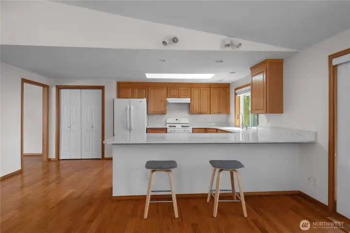Beautiful quartz countertops and extra deep breakfast bar offers tons of work space.