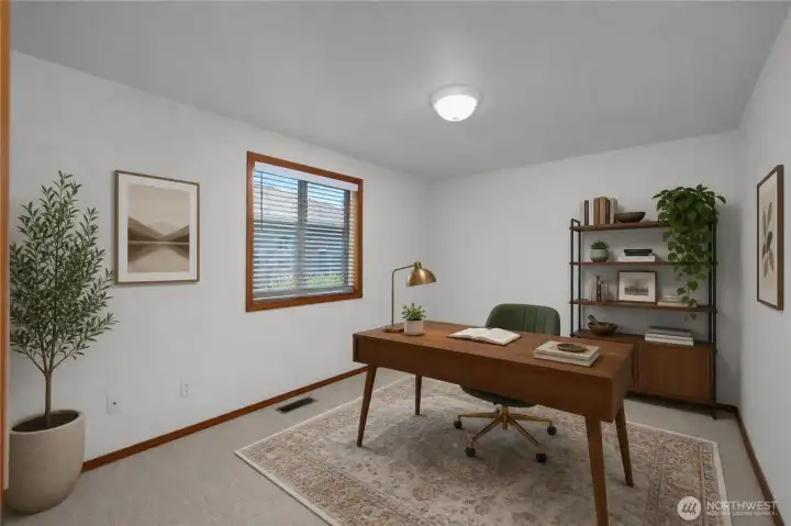Currently staged as a home office, this secondary bedroom offers flexible space to suit your needs.