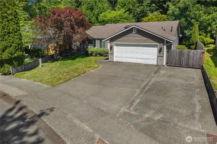 RV/boat parking is complemented by a double-wide gate providing access to additional secure parking behind the fence.