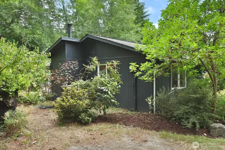 Walking around the home there is a flat yard with both a covered porch and back yard patio. There are ample parking spots for vehicles. Walking around the home there is a flat yard with both a covered porch and back yard patio. There are ample parking spots for vehicles.