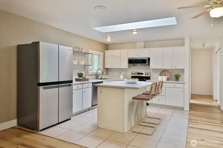 The kitchen features newer appliances that are 3-5 years old. The kitchen features newer appliances that are 3-5 years old.