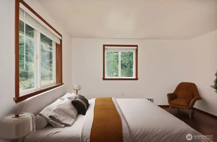 The Primary Bedroom has a wood laminate flooring a different color than the rest of the house. Virtually staged. The Primary Bedroom has a wood laminate flooring a different color than the rest of the house. Virtually staged.