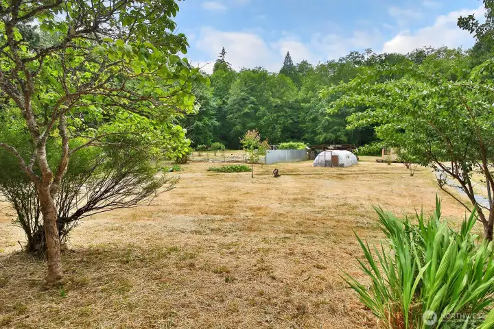 The property is mostly flat in the center with some slope around the wooded edges. The property is mostly flat in the center with some slope around the wooded edges.