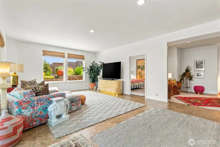 Lower level family room with view into second bedroom and bonus room on the right Lower level family room with view into second bedroom and bonus room on the right