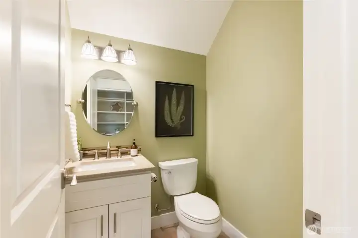The 1/2 bath is located just off the entrance to the garage The 1/2 bath is located just off the entrance to the garage