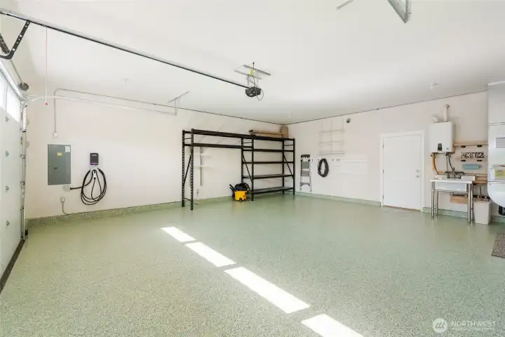 New epoxy floor, electric car charger, 30 amp RV plug and heavy duty shelving New epoxy floor, electric car charger, 30 amp RV plug and heavy duty shelving