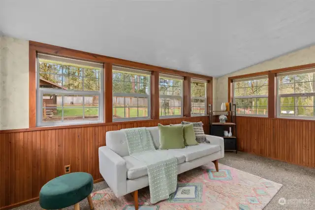 Sunroom/Den which leads you outside to the most gorgeous backyard Oasis.