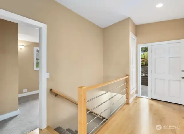 Entrance to 2nd bedroom and stairs down to lower level.