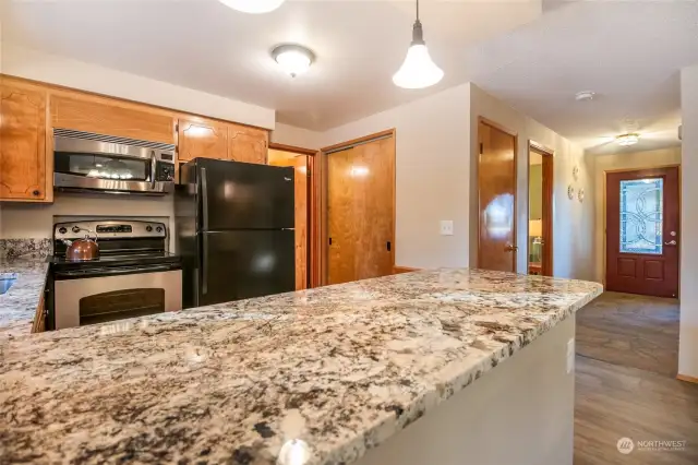 There is a pantry closet with ample shelving, and an additional pantry through the door to the laundry room.