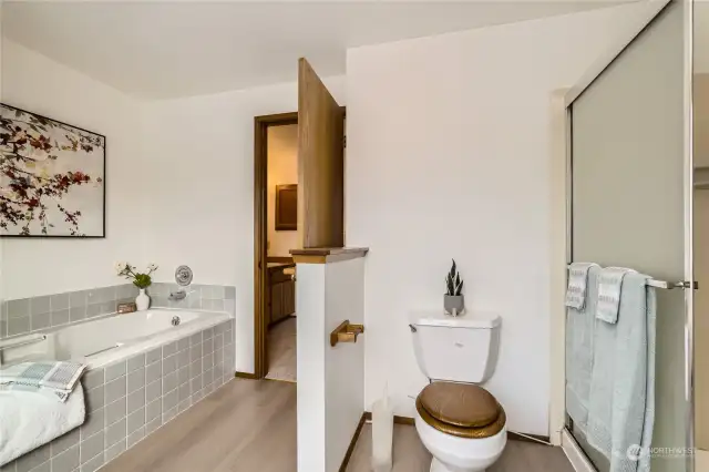 Primary bath with soaking tub and separate shower.