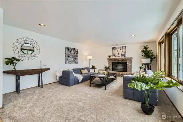 A wood-burning fireplace in the family room invites relaxation.