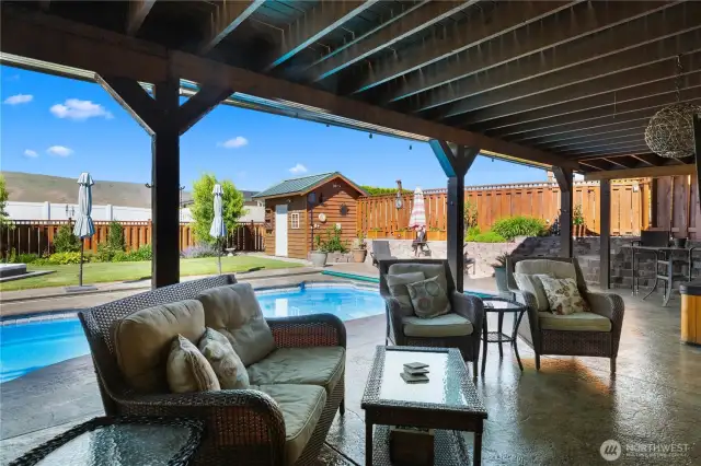 Lower covered patio adjacent to lower bar.
