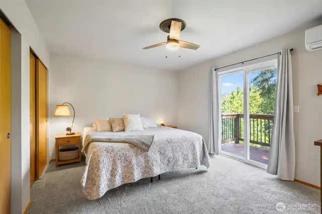 Primary bedroom with a private deck and amazing view!