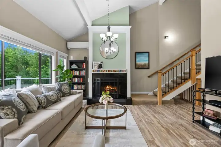 Living room looking towards main floor entrance hallway and stairwell to 2nd floor