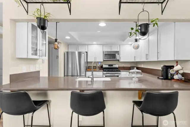 Breakfast bar and kitchen looking from dining area