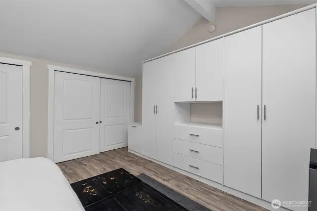 Primary bedroom - tons of closet space, wardrobe, and inside the walk-in closet is a doorway to added storage space