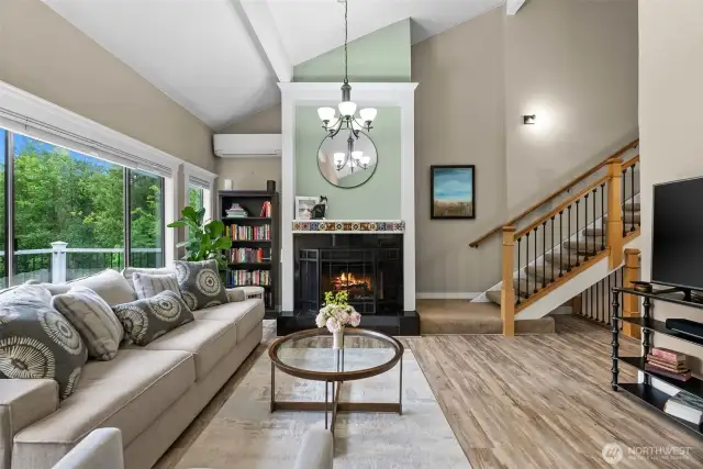 Living room looking towards main floor entrance hallway and stairwell to 2nd floor