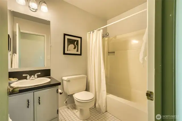 Guest bath with tub convenient to living/dining and  secondary bedroom.