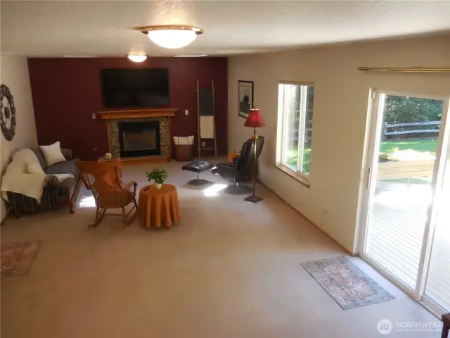 Family Room-5 steps Down from Main Level, Slider to lower back deck, Half Bath & Utility Room, Oh- Garage door is here also!!
