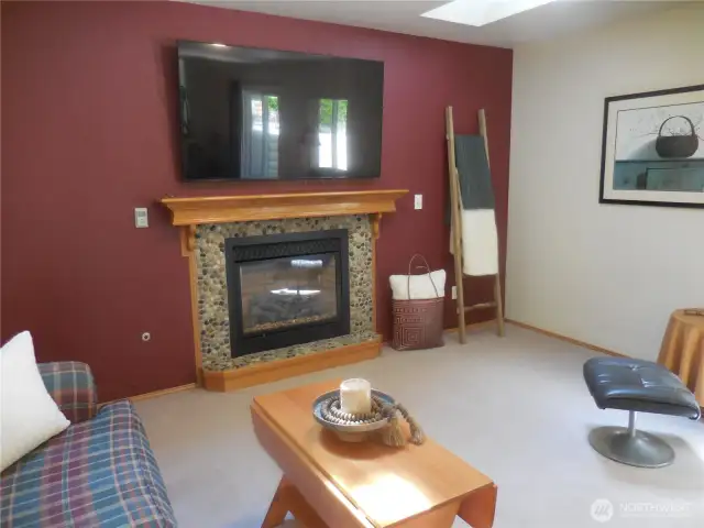 Gas Lite Fireplace w/ Mantel - TV does not convey.
