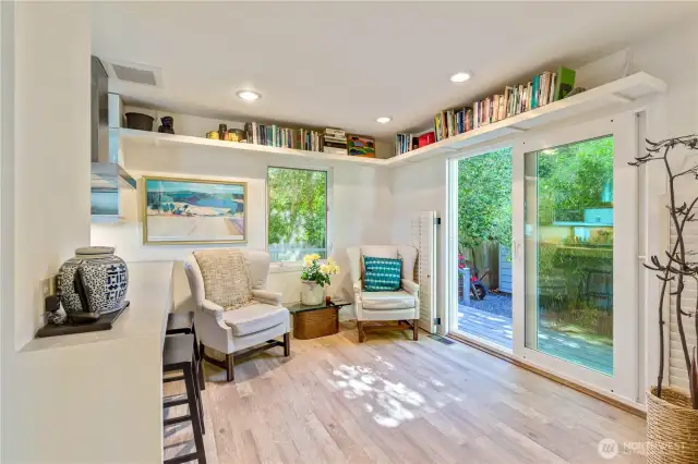 Walk through the sliding glass doors to the 270 degree wrap-around deck and the detached garage with space for an office, gym, art studio, play room, etc.