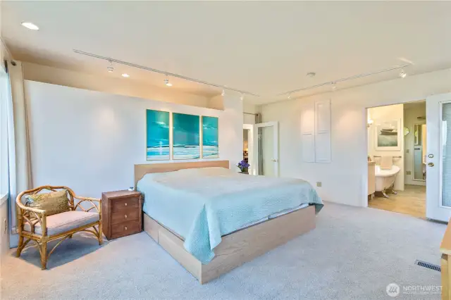 The en suite bathroom features a soaking tub, shower, closet and washer/dryer hookup.