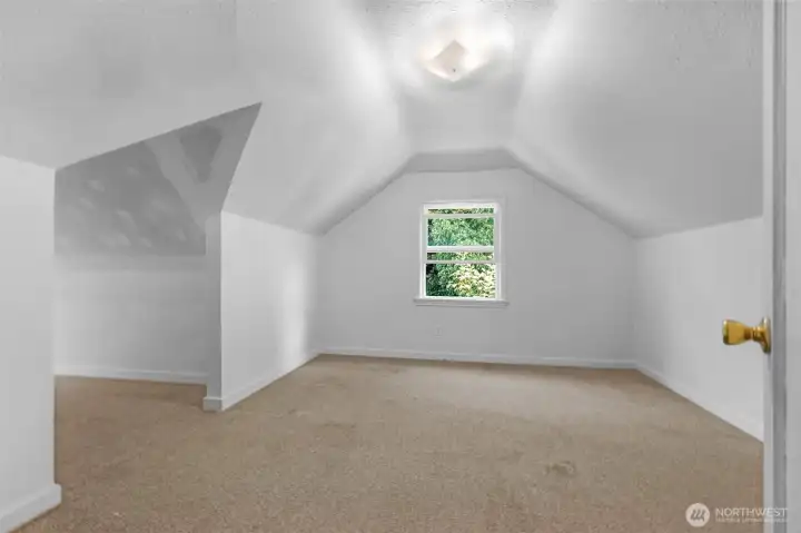 Upstairs showcases two bedrooms and a reading nook area.